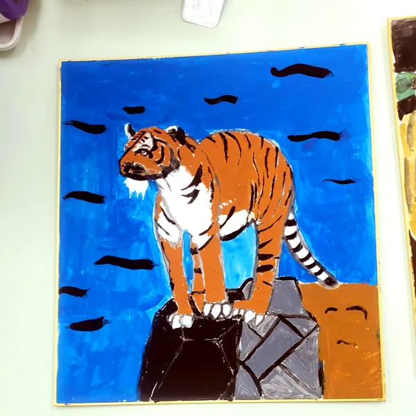 生徒の作品:青い背景のトラの絵